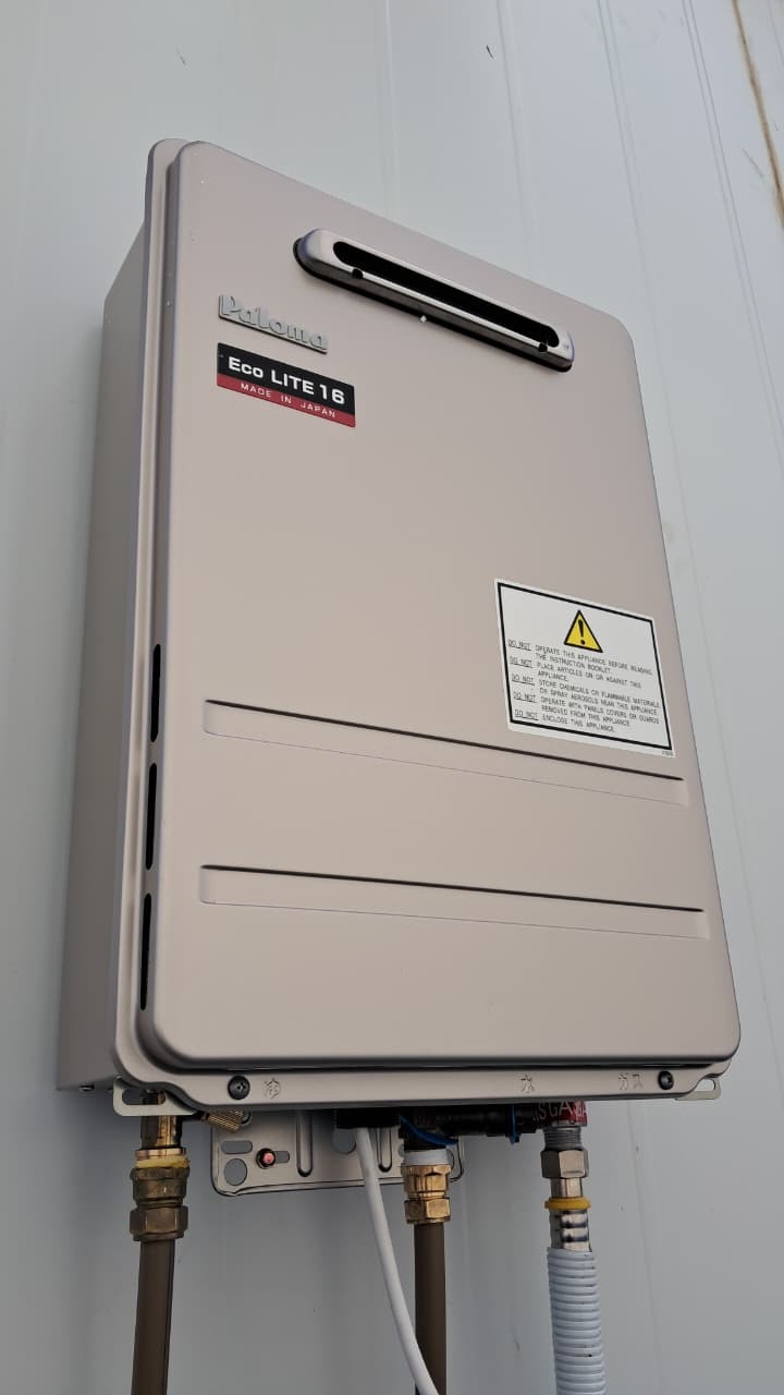 Paloma Eco Lite 16 gas geyser installation on a light exterior wall in George